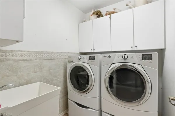 a utility room with dryer and washer