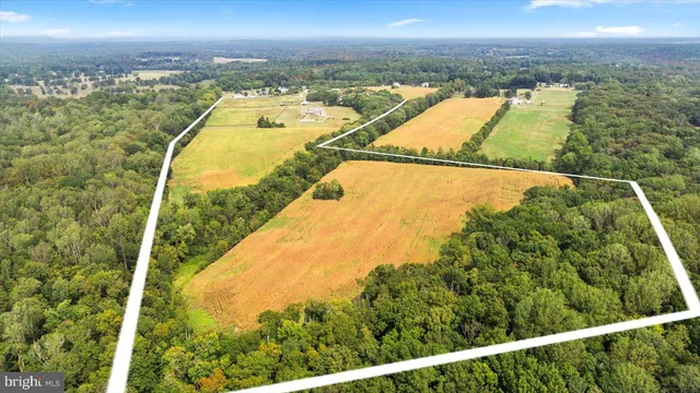 a bathroom with a sink mirror and toilet