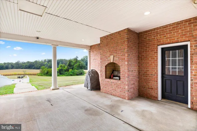 a living room with furniture window and a fireplace