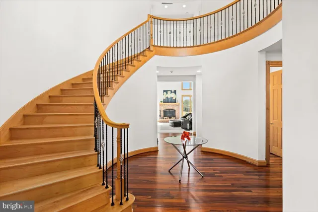 a large white kitchen with stainless steel appliances lots of counter top space