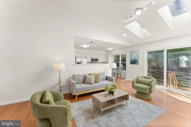 a living room with furniture rug and window