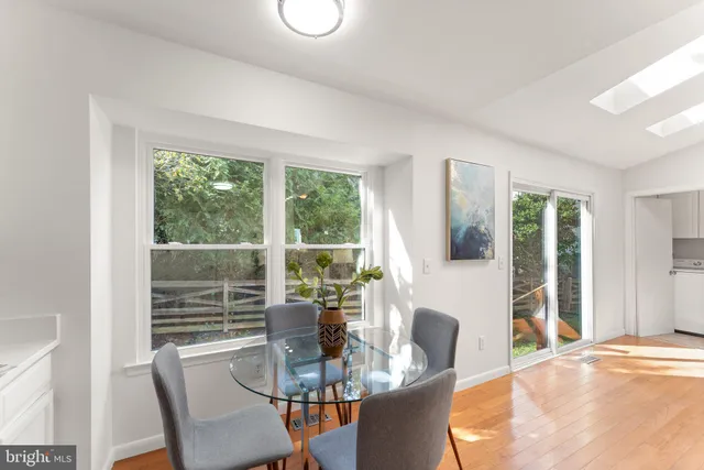 a dining room with furniture window and outside view