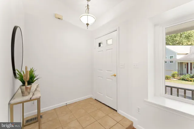 a view of entryway with wooden floor