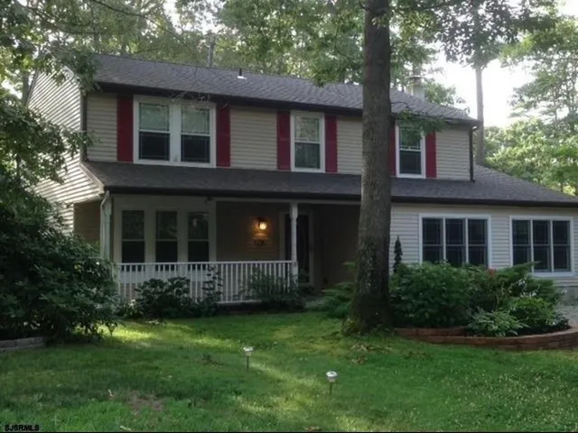 a brick house with a large windows