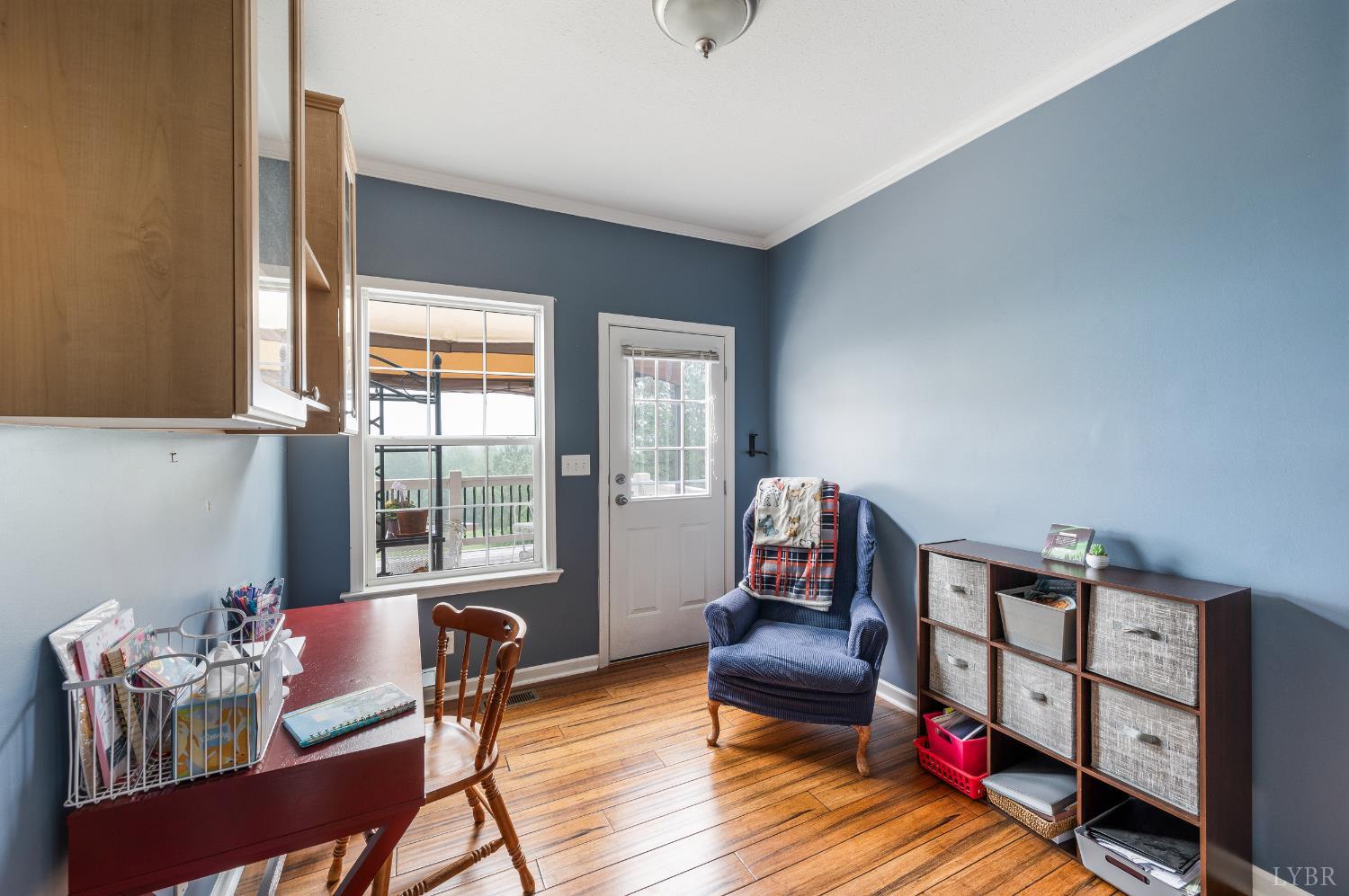 491 Pacoman Road Evington, VA 24550 - Photo 25 of 77 a living room with furniture cabinets and a window