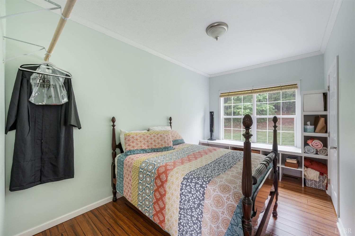 491 Pacoman Road Evington, VA 24550 - Photo 33 of 77 a bedroom with a bed and a book shelf