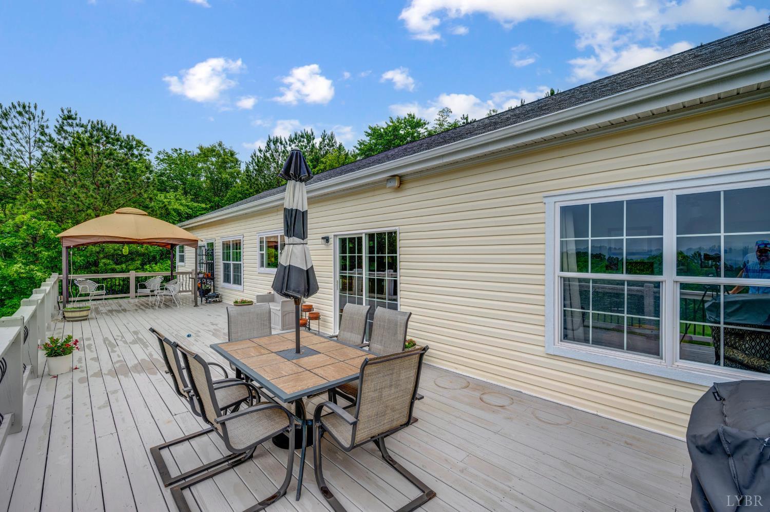 491 Pacoman Road Evington, VA 24550 - Photo 61 of 77 a view of a house with backyard and sitting area