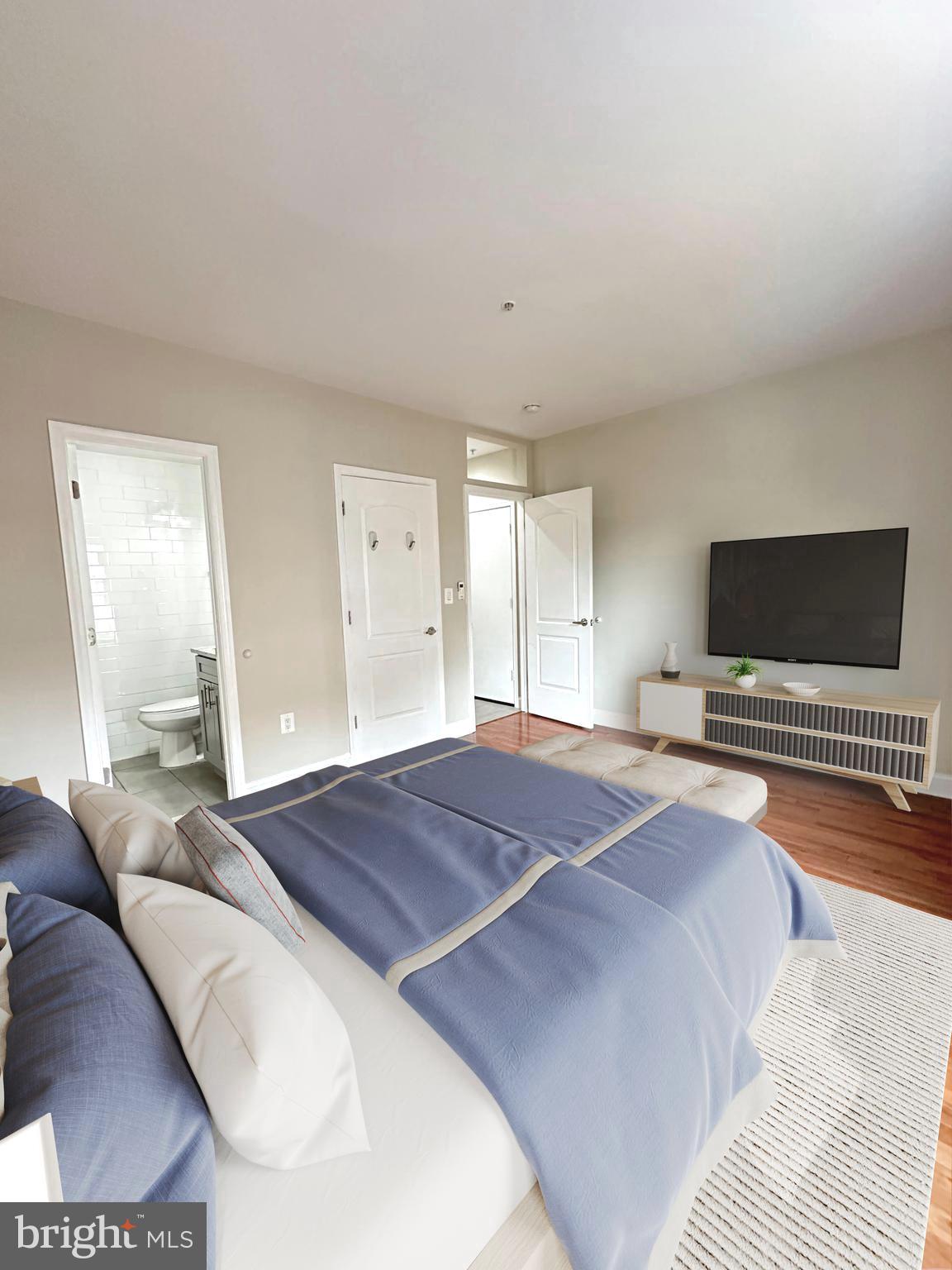 1626 R Street Southeast Washington, DC 20020 - Photo 4 of 17 a bedroom with a bed and a flat screen tv