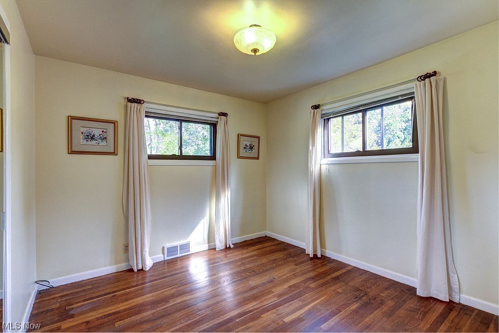 4897 South Sedgewick Road Cleveland, OH 44124 - Photo 14 of 31 Corner bedroom with hardwood flooring bathed in warm natural light