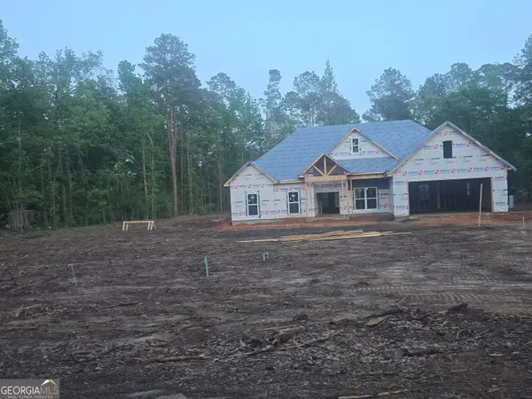 a house with trees in the background
