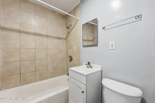 a view of a bathroom from a hallway