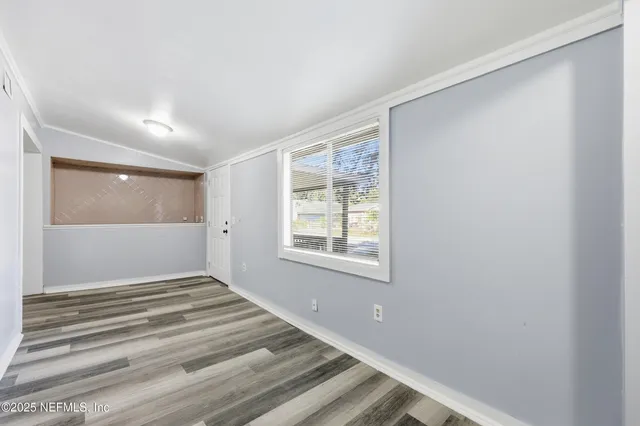 a view of a room that has a window in it