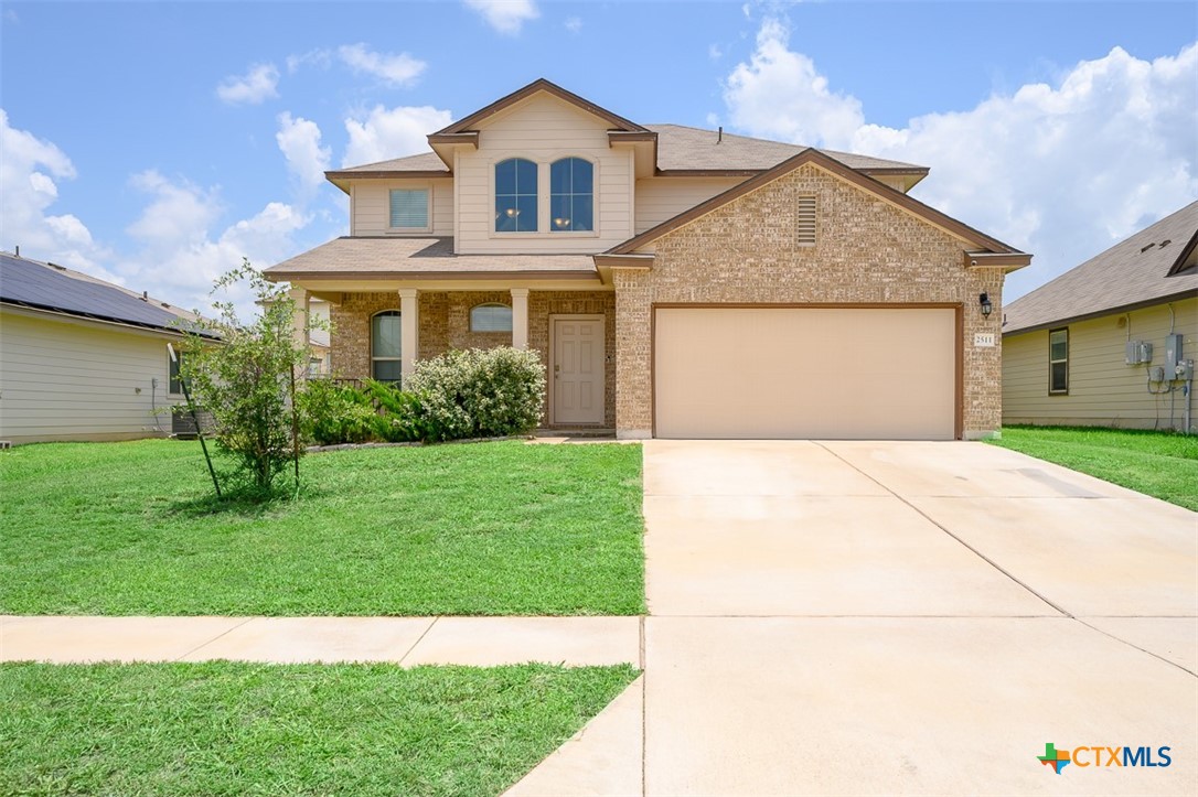 2511 Pintail Loop Copperas Cove, TX 76522 - Photo 26 of 26 a front view of a house with a yard and garage