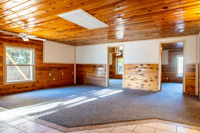 a view of a room with furniture and window