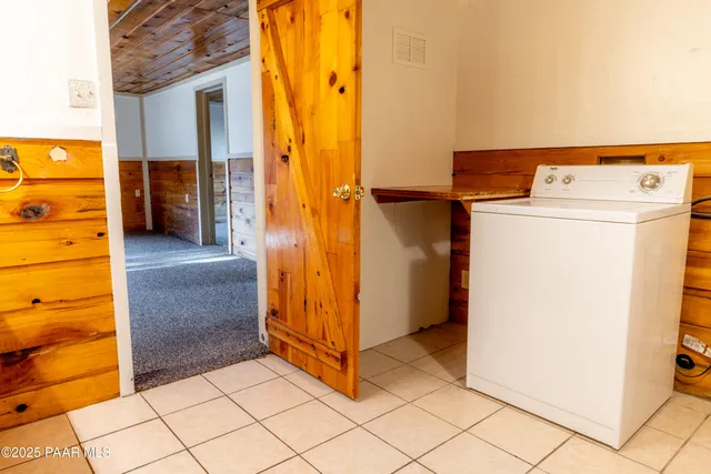 an empty room with fan and fan