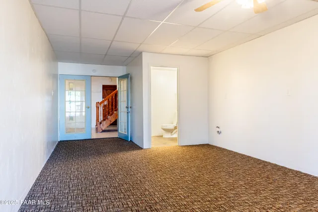 a kitchen with cabinets stainless steel appliances and sink