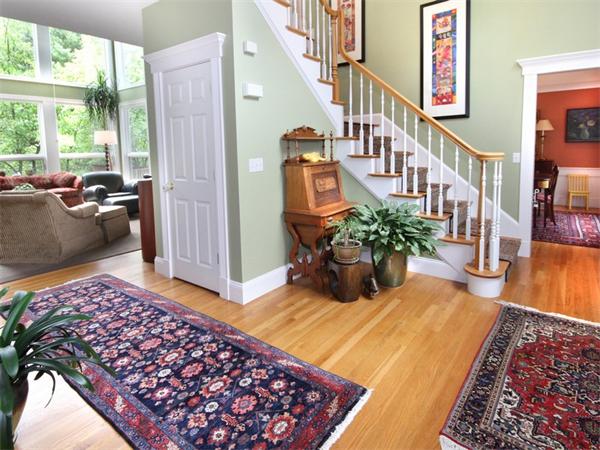 191 Burroughs Road Boxborough, MA 01719 - Photo 8 of 20 a living room with furniture fireplace and a table