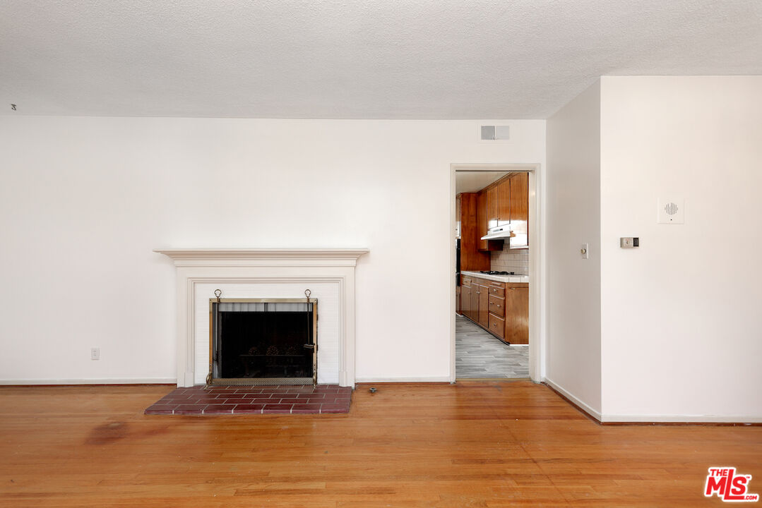 10310 Cullman Avenue Whittier, CA 90603 - Photo 17 of 30 a view of an empty room and fire place