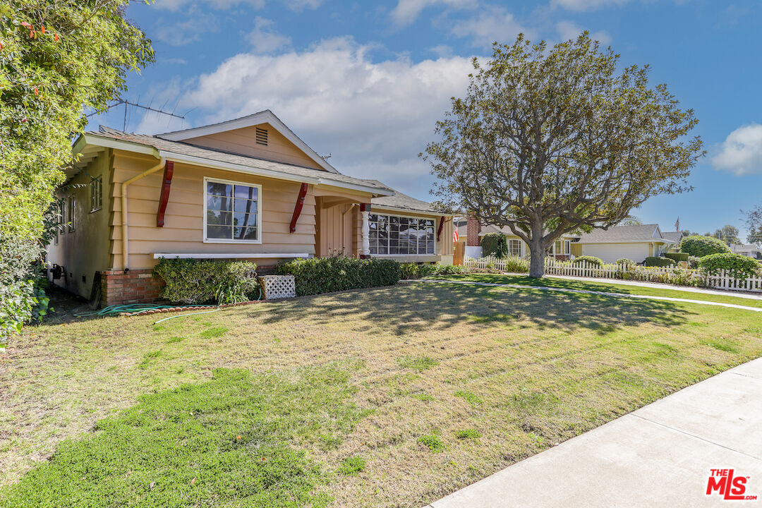 10310 Cullman Avenue Whittier, CA 90603 - Photo 2 of 30 a front view of a house with garden