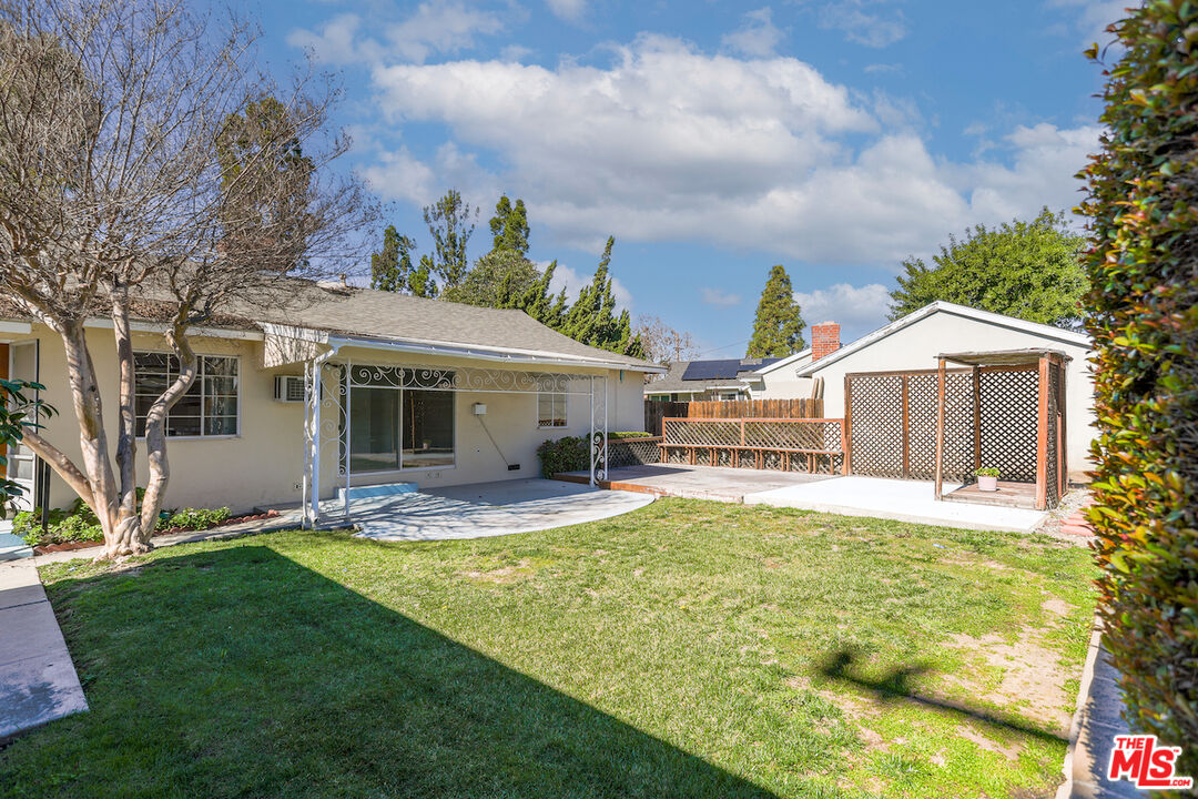 10310 Cullman Avenue Whittier, CA 90603 - Photo 26 of 30 a view of a house with swimming pool and a yard