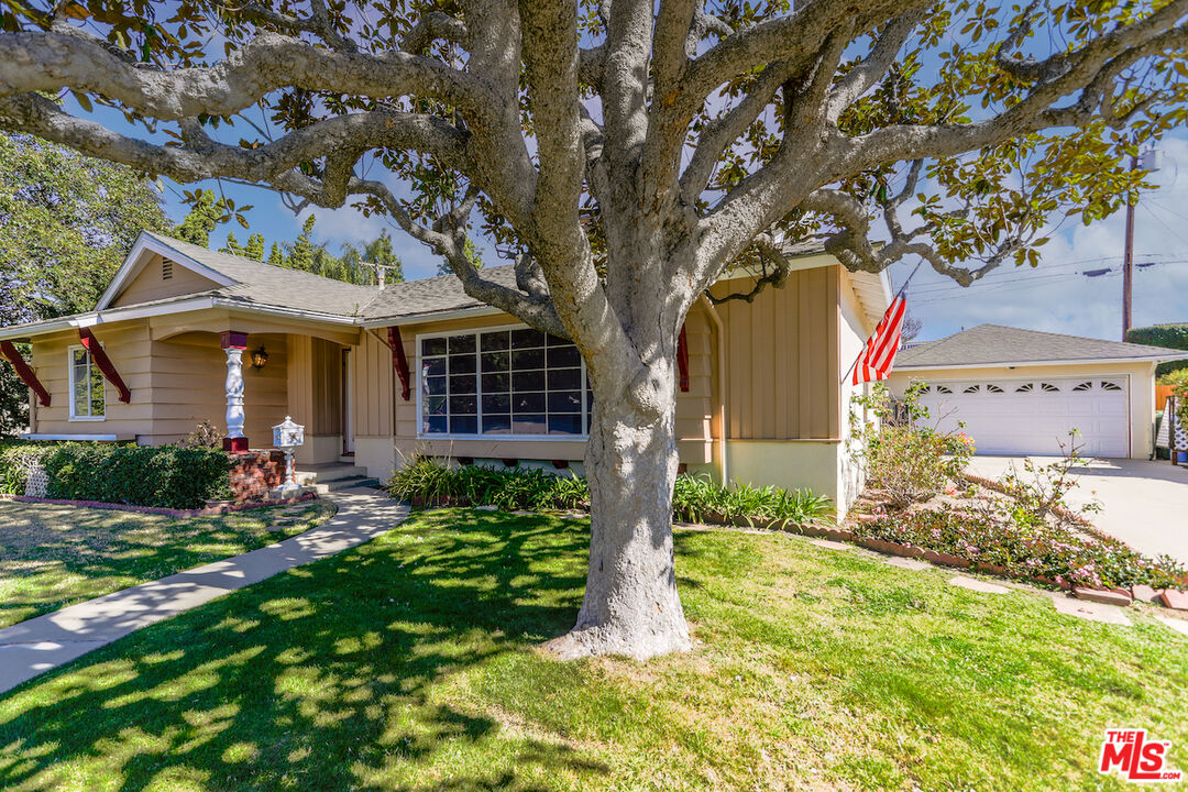 10310 Cullman Avenue Whittier, CA 90603 - Photo 3 of 30 a front view of a house with garden