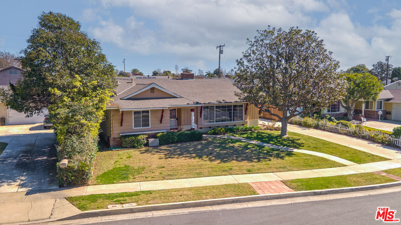 10310 Cullman Avenue Whittier, CA 90603 - Photo 5 of 30 a front view of a house with a yard table and chairs