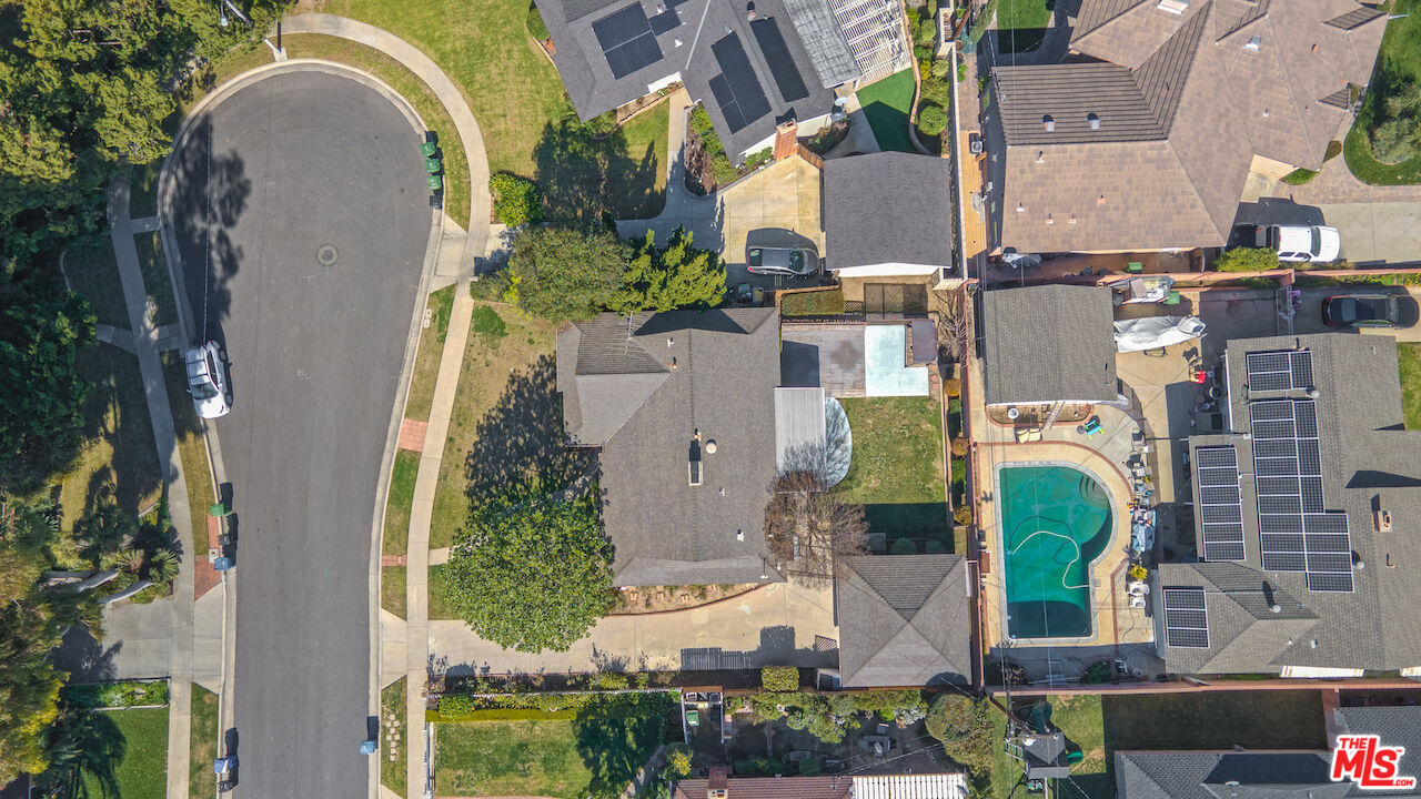10310 Cullman Avenue Whittier, CA 90603 - Photo 10 of 30 an aerial view of a house with yard and swimming pool