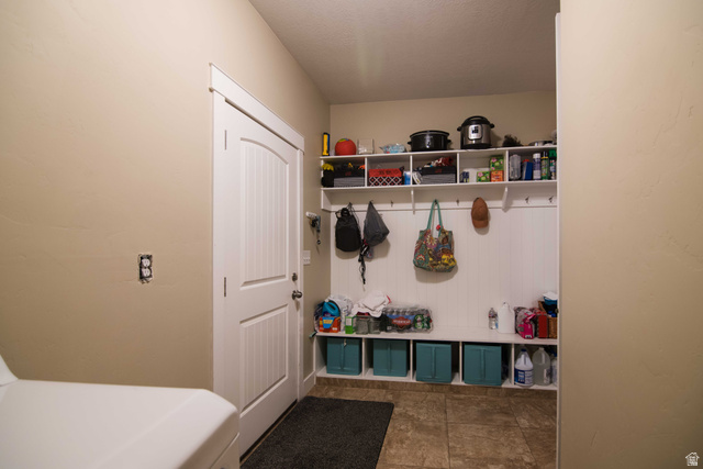 646 East 1400th Street North Mapleton, UT 84664 - Photo 24 of 78 Mudroom featuring built-in shelving, storage cubbies, and wall hooks