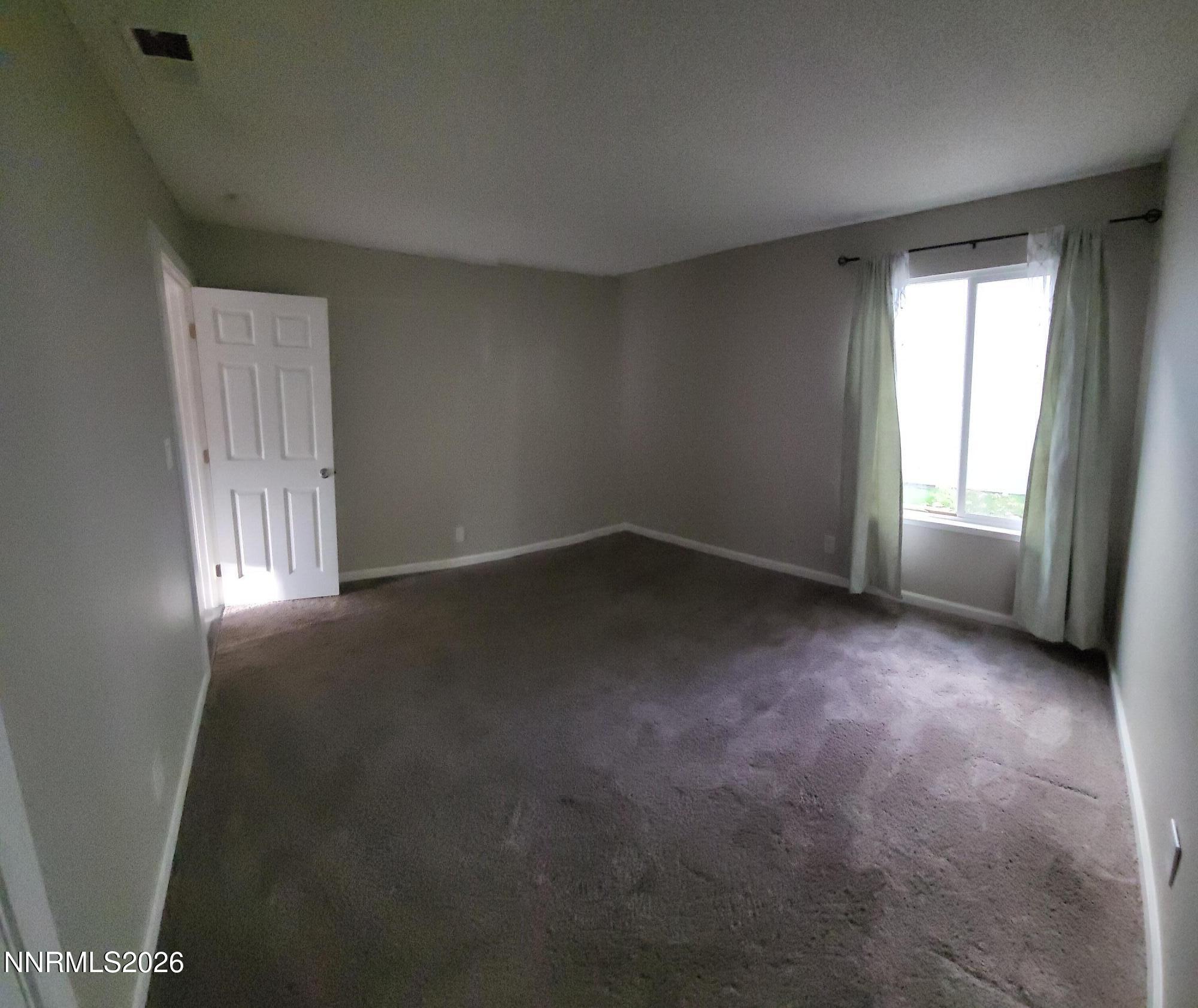 4606 Neil Road, Unit 197 Reno, NV 89502 - Photo 10 of 26 an empty room with windows