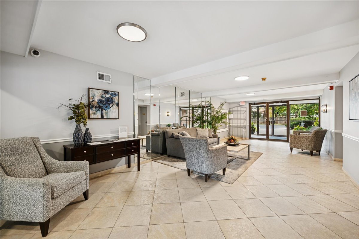 175 Lake Boulevard, Unit 301 Buffalo Grove, IL 60089 - Photo 13 of 15 a living room with furniture and a large window