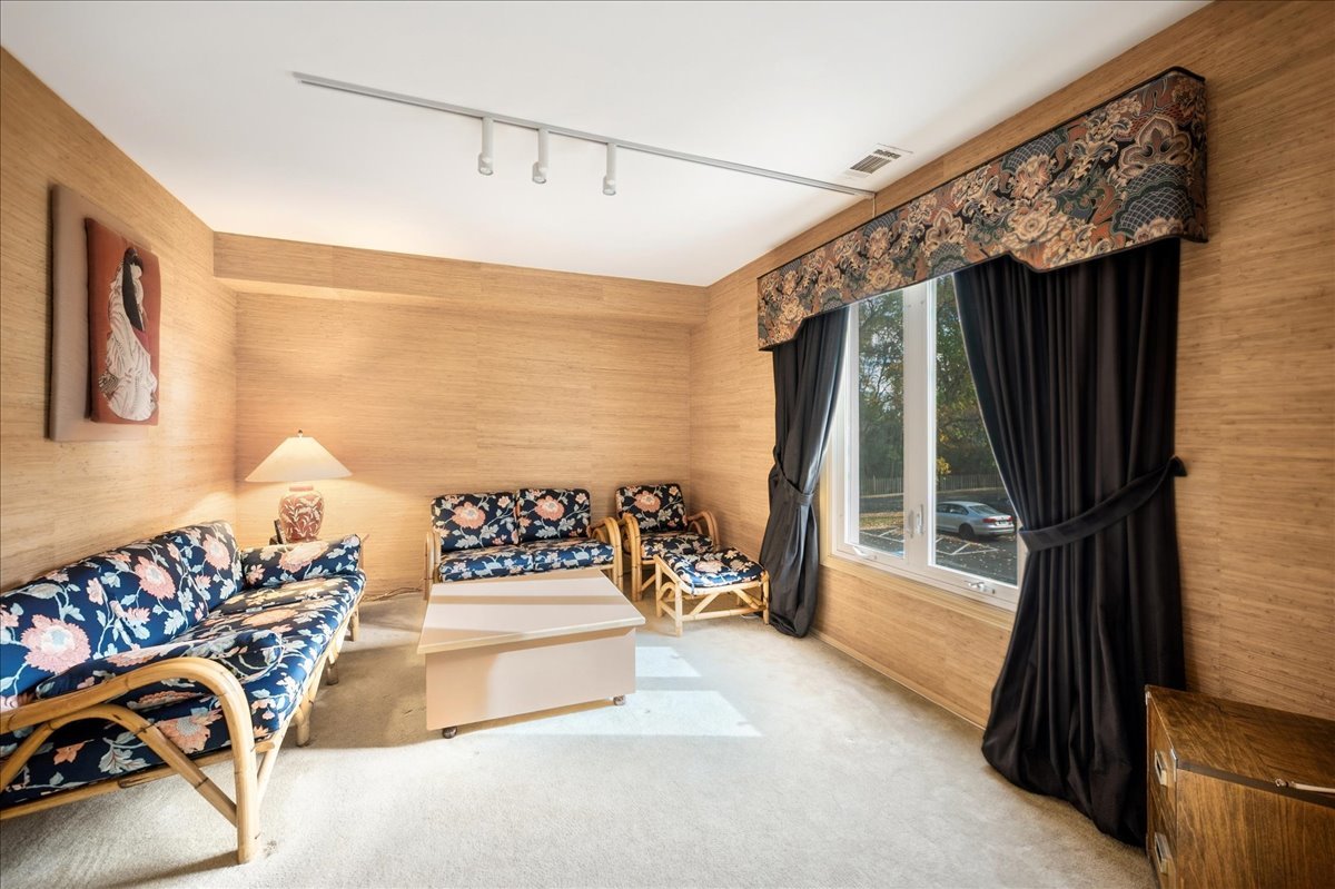 175 Lake Boulevard, Unit 301 Buffalo Grove, IL 60089 - Photo 8 of 15 a bedroom with furniture and a large window