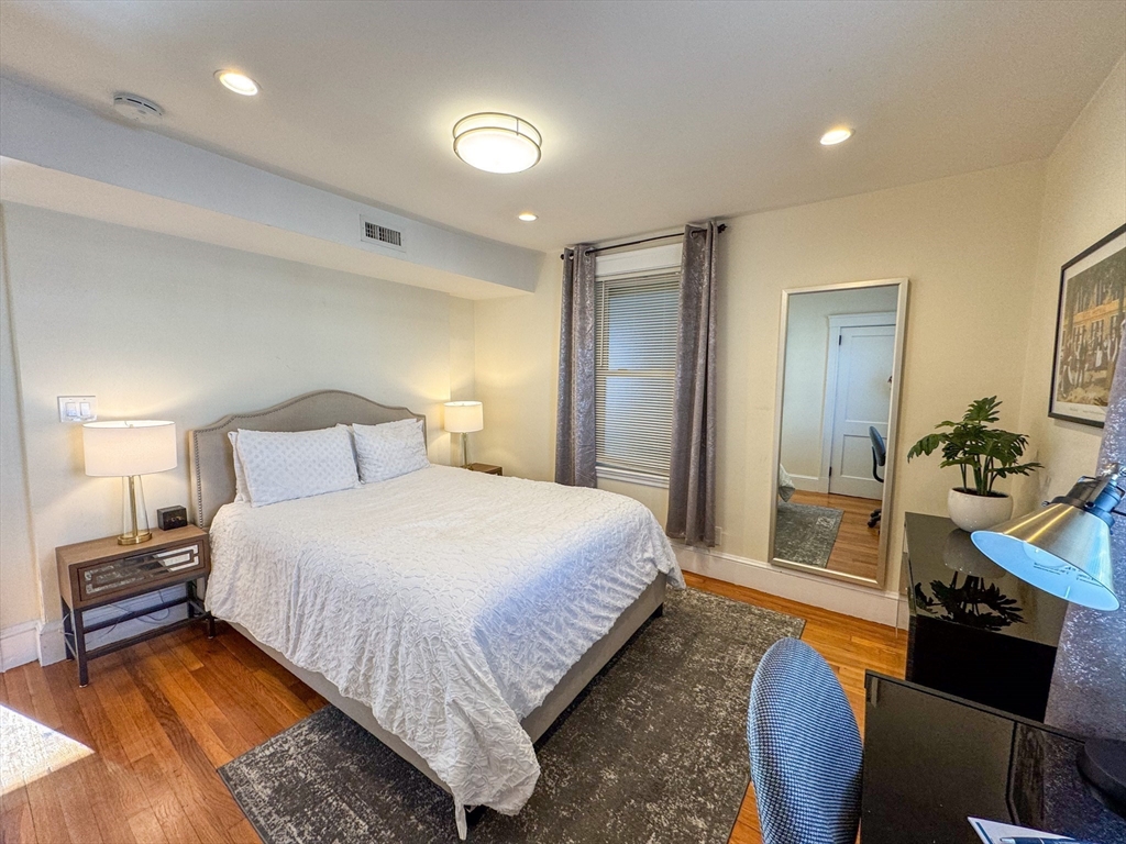 30 Clay Street, Unit 3FURNISHED Cambridge, MA 02140 - Photo 11 of 14 a bedroom with a bed and a couch