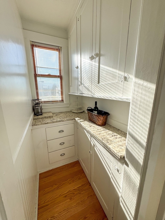 30 Clay Street, Unit 3FURNISHED Cambridge, MA 02140 - Photo 6 of 14 a kitchen with white cabinets and window
