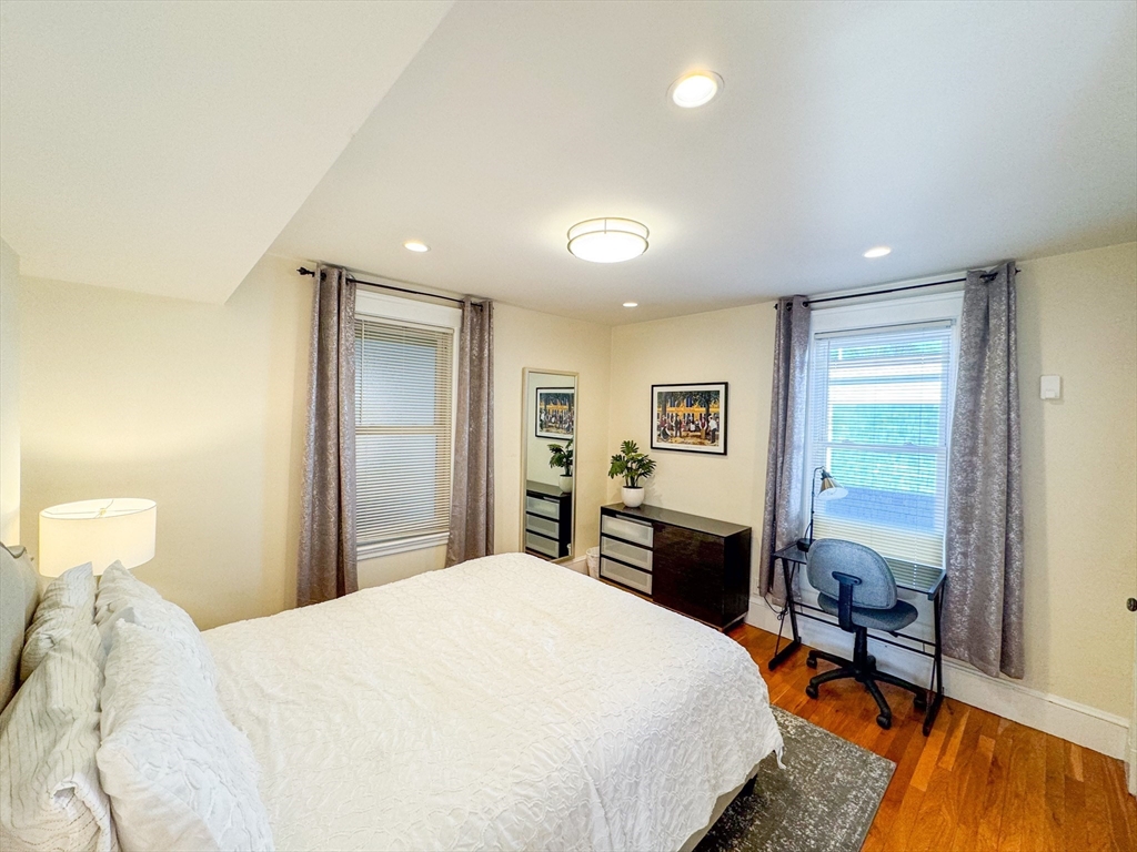 30 Clay Street, Unit 3FURNISHED Cambridge, MA 02140 - Photo 10 of 14 a bedroom with a bed and wooden floor
