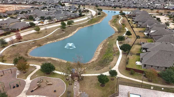 an aerial view of a house with a swimming pool