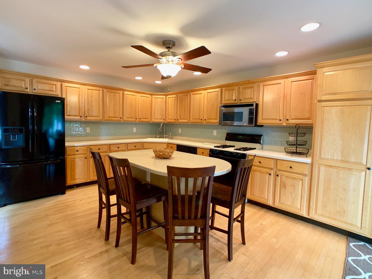 128 Coburn Road Pennington, NJ 08534 - Photo 14 of 39 Center island and Corian Counters throughout