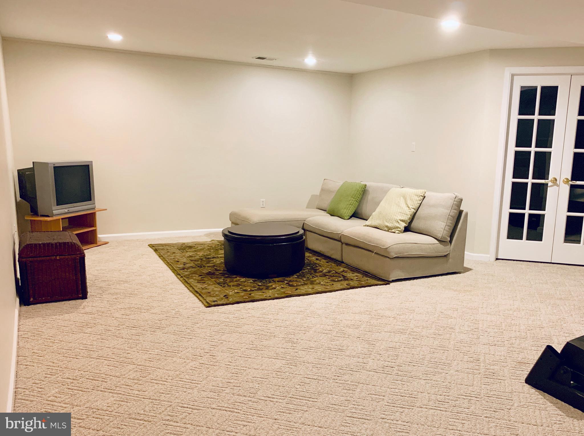 128 Coburn Road Pennington, NJ 08534 - Photo 31 of 39 French doors in basement lead to Bonus room