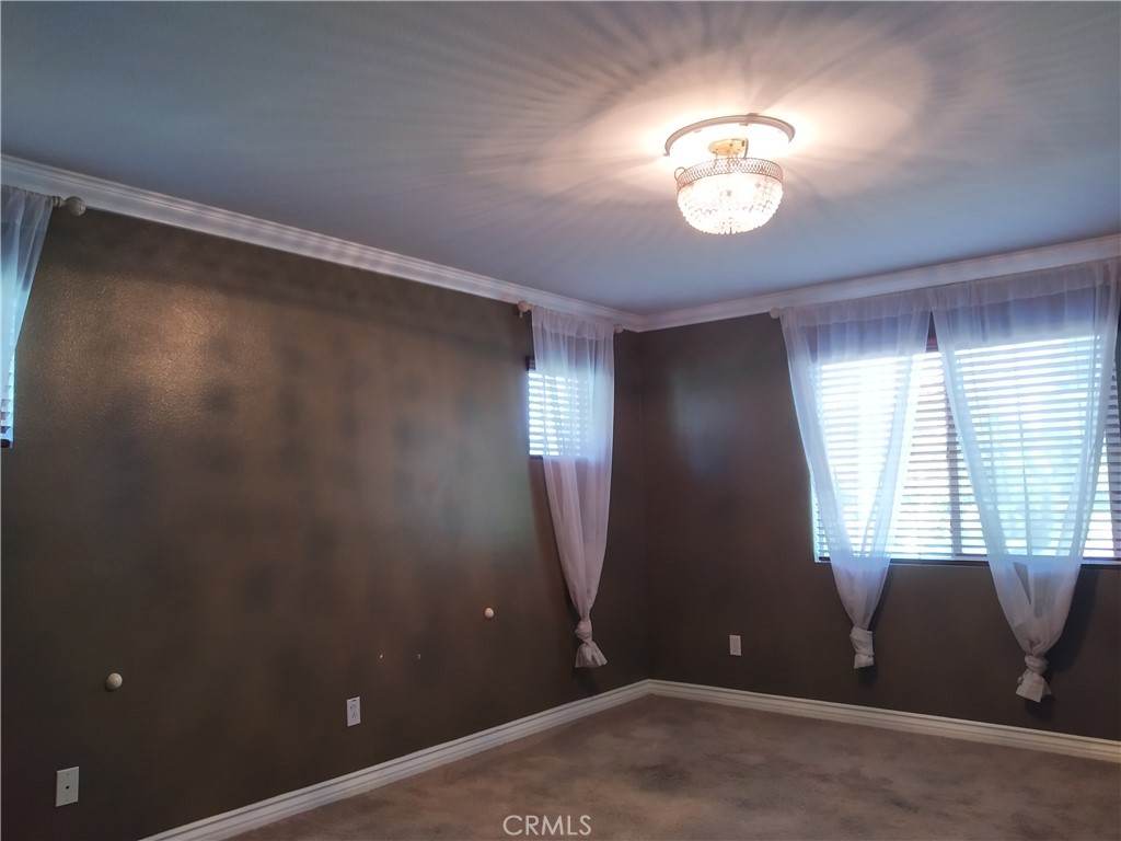 7715 Abbot Court Rancho Cucamonga, CA 91730 - Photo 12 of 22 wooden floor in an empty room with a window