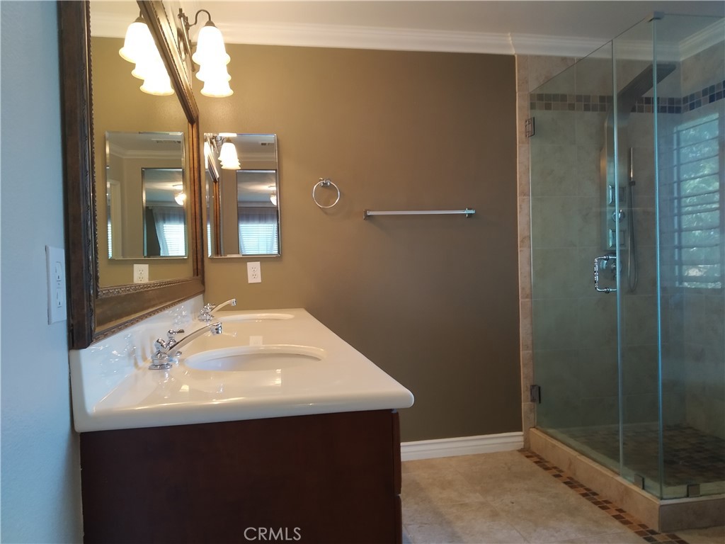 7715 Abbot Court Rancho Cucamonga, CA 91730 - Photo 13 of 22 a bathroom with a sink and a mirror