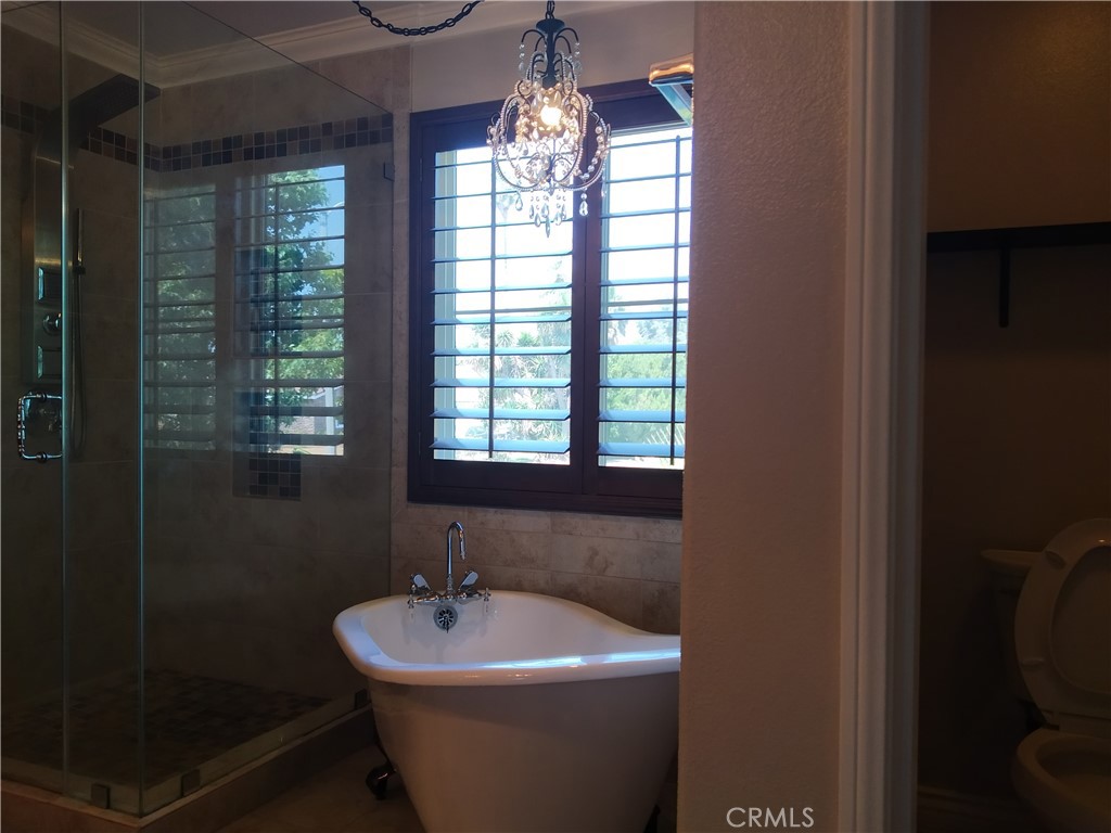 7715 Abbot Court Rancho Cucamonga, CA 91730 - Photo 14 of 22 a bathroom with a sink mirror and window
