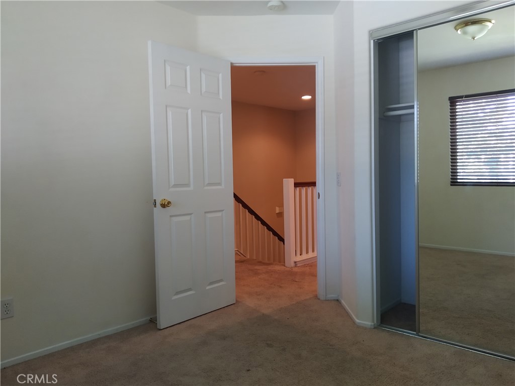 7715 Abbot Court Rancho Cucamonga, CA 91730 - Photo 16 of 22 an empty room with windows and closet