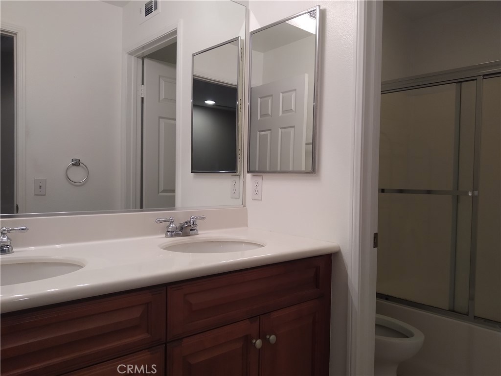 7715 Abbot Court Rancho Cucamonga, CA 91730 - Photo 17 of 22 a bathroom with a sink and a mirror