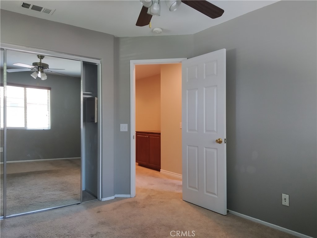 7715 Abbot Court Rancho Cucamonga, CA 91730 - Photo 19 of 22 an empty room with windows and closet