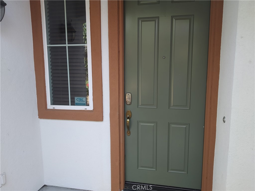 7715 Abbot Court Rancho Cucamonga, CA 91730 - Photo 6 of 22 a view of front door of a house
