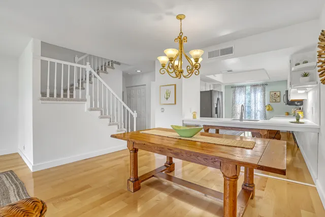 a living room with furniture and a large window with outer view