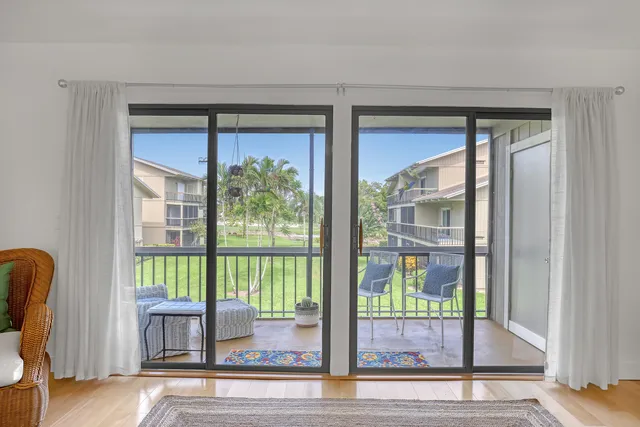 a kitchen with a sink cabinets and window