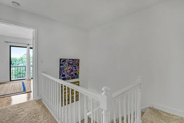 a bathroom with a granite countertop sink mirror vanity and toilet
