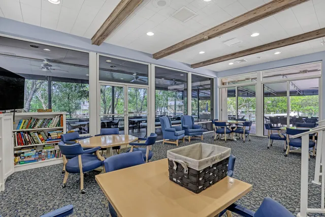 a view of swimming pool with outdoor seating