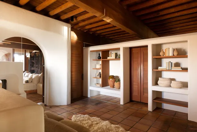 a view of a lake with couches and city view