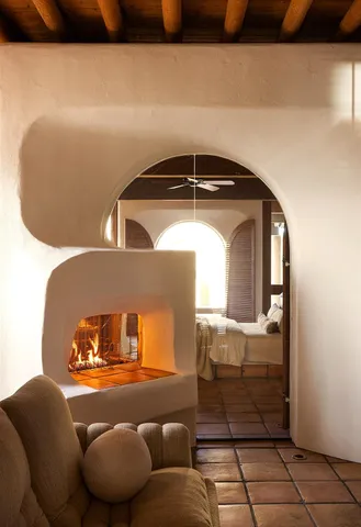 an aerial view of a house with a yard and mountain view in back